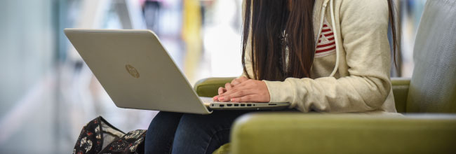 Female Student Using Laptop