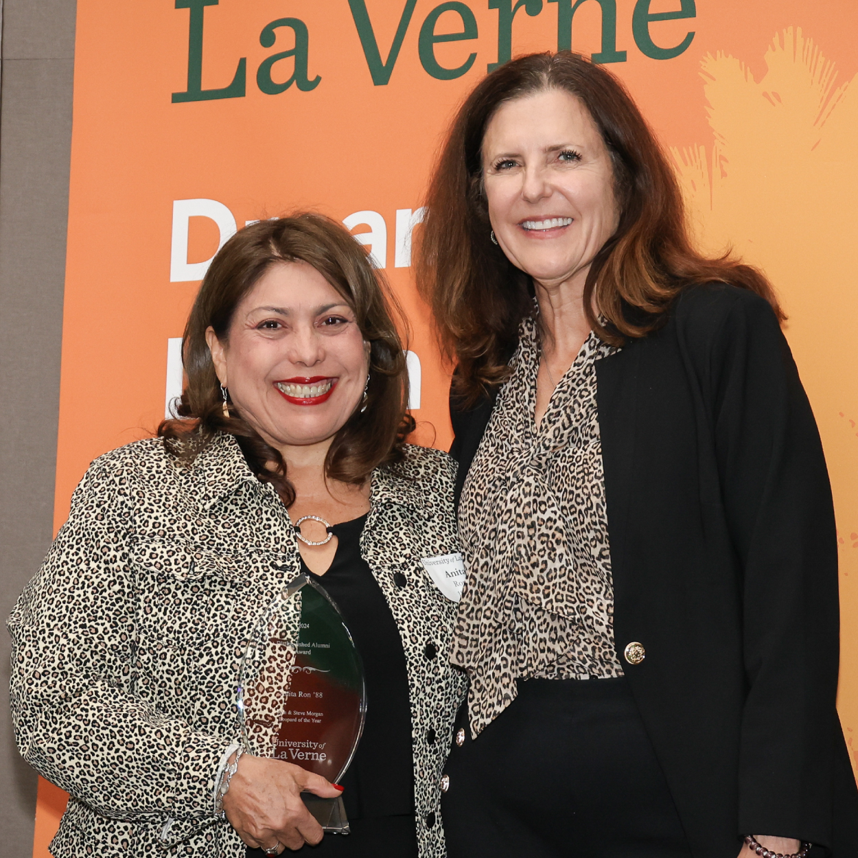 2023 Alumni Award winner Anita Ron with interim university president Risa Dickson.