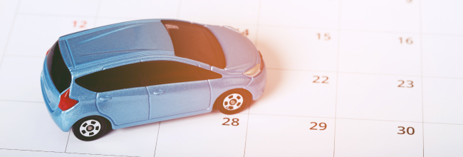 Car on top of a calendar.